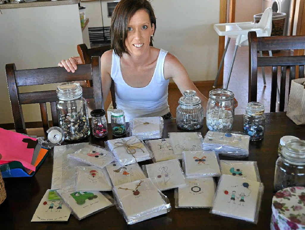 Jo Cuskelly uses quirky buttons to make unique Christmas cards like the ones pictured below.